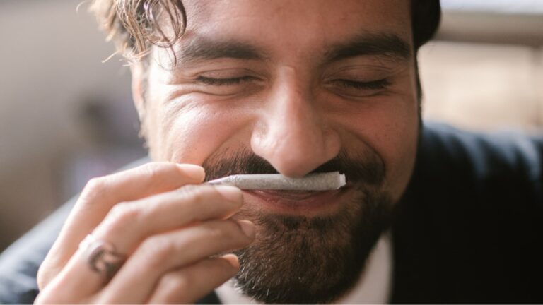 Man smelling terpenes in cannabis in a pre-roll from NJ dispensary
